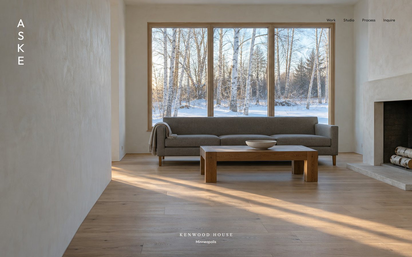 The Aske homepage: a pale living room with a wall of windows onto birches in snow, the name set down the left edge.